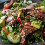 ['Close-up of a vibrant low-carb beef salad featuring lean cuts of beef and fresh vegetables.', 'Side view of a healthy beef salad with colorful ingredients like greens, tomatoes, and avocado.', 'Juicy low-carb beef salad with mixed greens, bell peppers, and a drizzle of olive oil.', 'Detailed shot of an appetizing beef salad topped with cheese and hard-boiled eggs.']