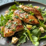 ['Juicy chicken salad with peaches and pecans in a close-up view.', 'A vibrant summer chicken salad featuring sliced peaches and nuts.', 'Colorful Hähnchensalat garnished with fresh ingredients and served in a bowl.', 'Close-up of a refreshing chicken salad with peaches and crunchy toppings.']