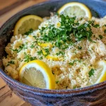 ['Close-up of Schnelles Lemon Parmesan Couscous with herbs and lemon zest.', 'Side view of a bowl filled with Schnelles Lemon Parmesan Couscous, garnished with fresh herbs.', 'Juicy Schnelles Lemon Parmesan Couscous showcasing fresh lemon and grated Parmesan.', 'Detailed shot of Schnelles Lemon Parmesan Couscous highlighting the vibrant ingredients.']