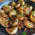 ['Close-up of juicy Spanish garlic shrimp on a plate, garnished with parsley.', 'Side view of succulent shrimp cooked in garlic, served in olive oil with a lemon wedge.', 'A detailed shot of flavorful Spanische Knoblauch-Garnelen with garlic and spices.', 'A vibrant image showcasing cooked shrimp, garlic, and fresh parsley in a rustic setting.']