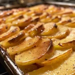 ['Close-up view of a creamy Apfel-Zwiebel-Aufstrich spread on a wooden board.', 'Side photo of Apfel-Zwiebel-Aufstrich with a fresh apple and onions in the background.', 'Juicy, golden apple and onion spread in a jar, showcasing its texture.', 'A vibrant apple and onion dip presented in a rustic dish, garnished with fresh thyme.']