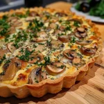 ['Close-up view of a slice of Schwarzwurzel Quiche on a plate, showcasing its fluffy texture.', 'A detailed shot of a savory Schwarzwurzel Quiche, highlighting the golden crust and filling.', 'Side perspective of a delicious Schwarzwurzel Quiche with visible layers and garnishes.', 'Juicy slice of Schwarzwurzel Quiche displayed on a rustic table, emphasizing its rich ingredients.']