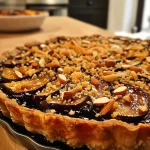 ['A side view of a slice of Schwarzwurzel Tarte topped with walnuts on a plate.', 'Close-up of a delectable Schwarzwurzel Tarte with a golden crust and walnut garnish.', 'A piece of lavish Schwarzwurzel Tarte showcasing its creamy filling and walnut topping.', 'Vibrant side view of a slice of Schwarzwurzel Tarte on a rustic wooden table.']